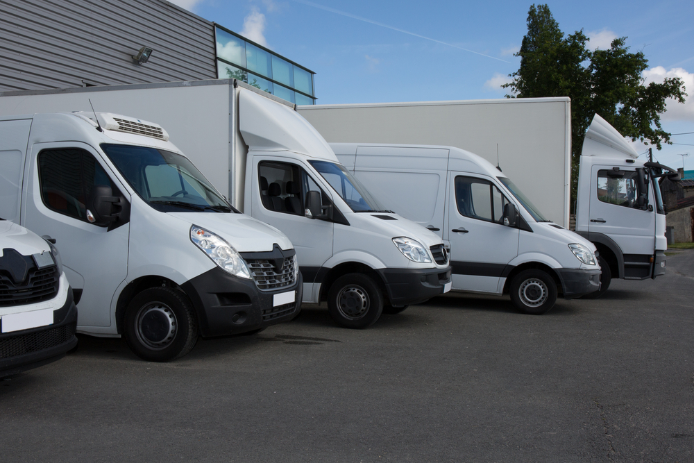 fleet of white vans and trucks